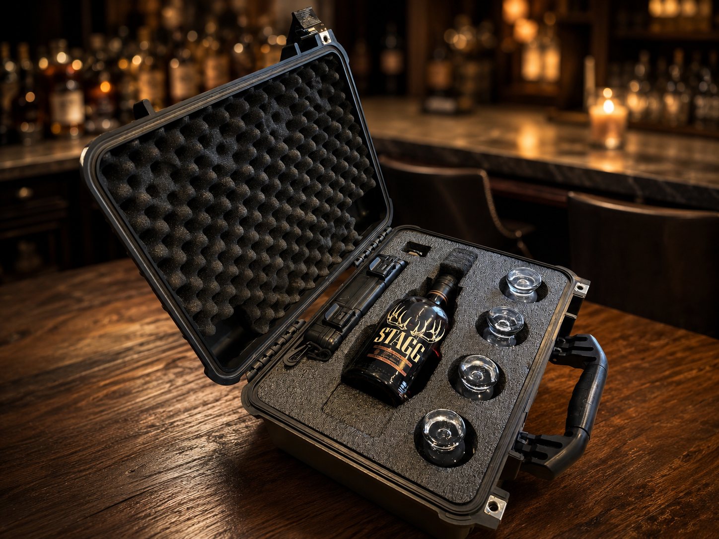Barrel Vault open on a bar top, holding a bottle and glassware