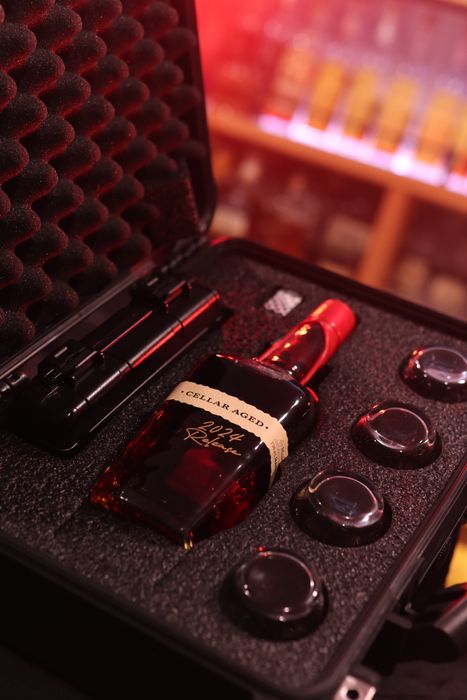 Barrel Vault case fitted with a whiskey bottle