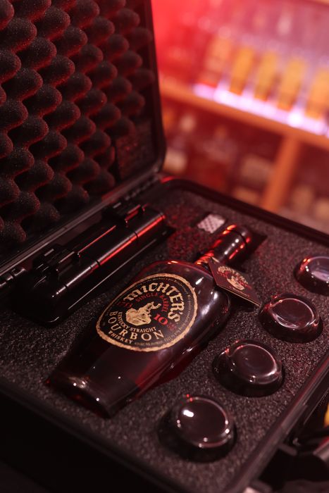 Barrel Vault case fitted with a whiskey bottle