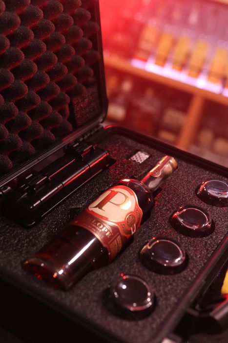 Barrel Vault case fitted with a whiskey bottle